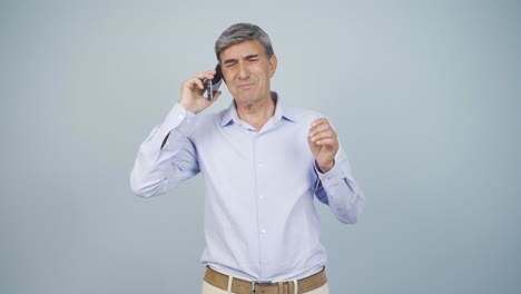 Old-man-getting-bad-news-on-the-phone-gets-upset.